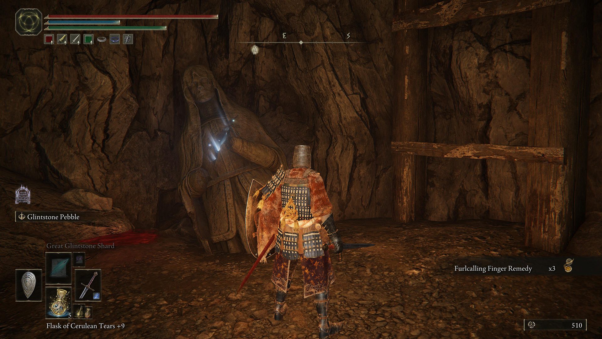 A cracked statue in Elden Ring's mid-game