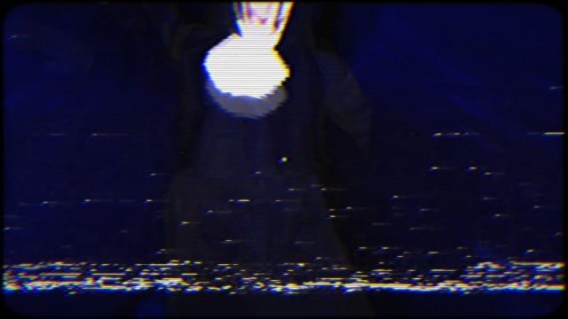 Grainy footage of a nun