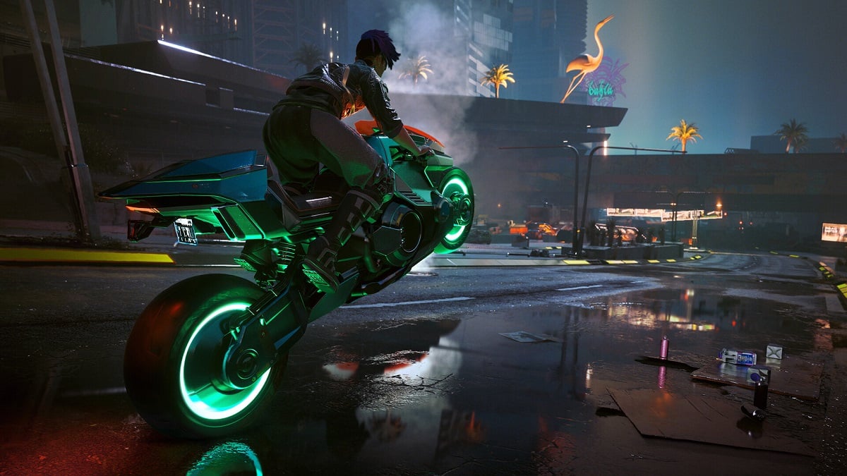 Cyberpunk 2077: a motorcyclist doing a wheelie across a wet road.