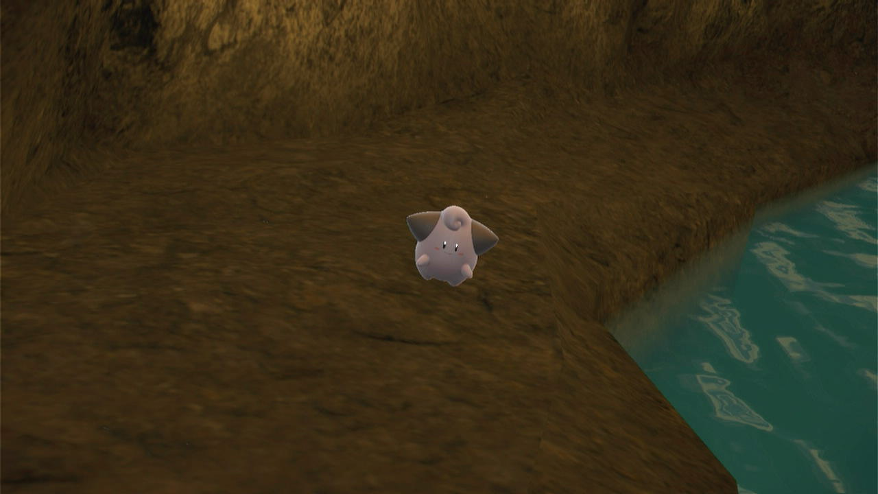 A screenshot of Cleffa inside the Oni Cave in Pokémon Scarlet and Violet: The Teal Mask