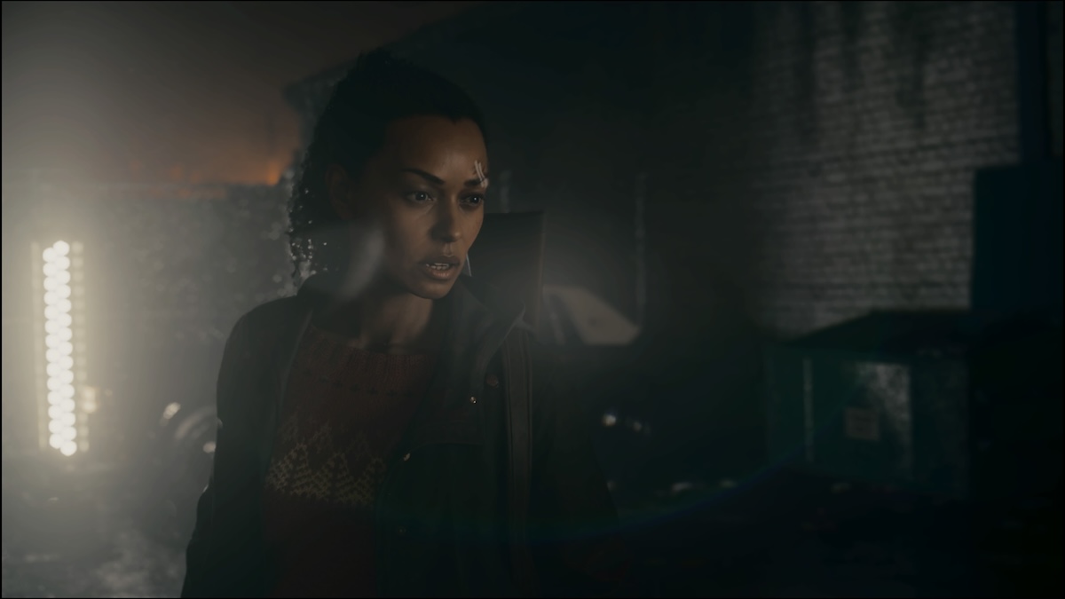 Saga Anderson standing in the light in Alan Wake 2.