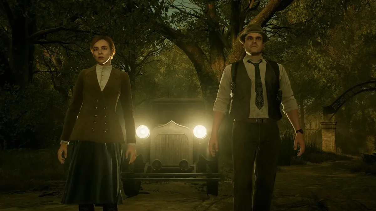 Alone in the Dark: Emily and Edward stood in front of car headlights.