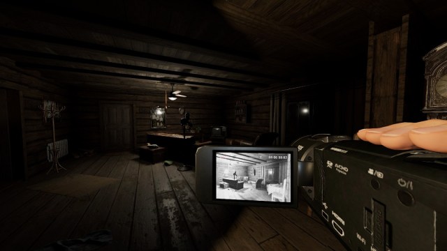 Phasmophobia: the Tier 2 Video Camera showing a night-vision image of a living room in its viewfinder.