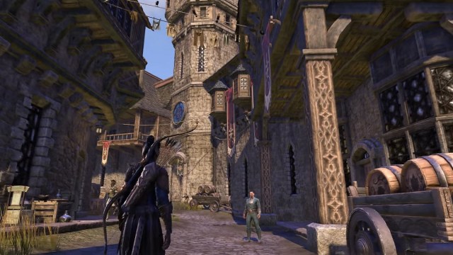 The Elder Scrolls Online: a character walks through a medieval-looking town.