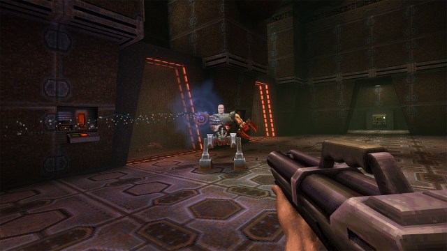 Quake 2: the player aims the Super Shotgun at a Strogg Gladiator in the prison.