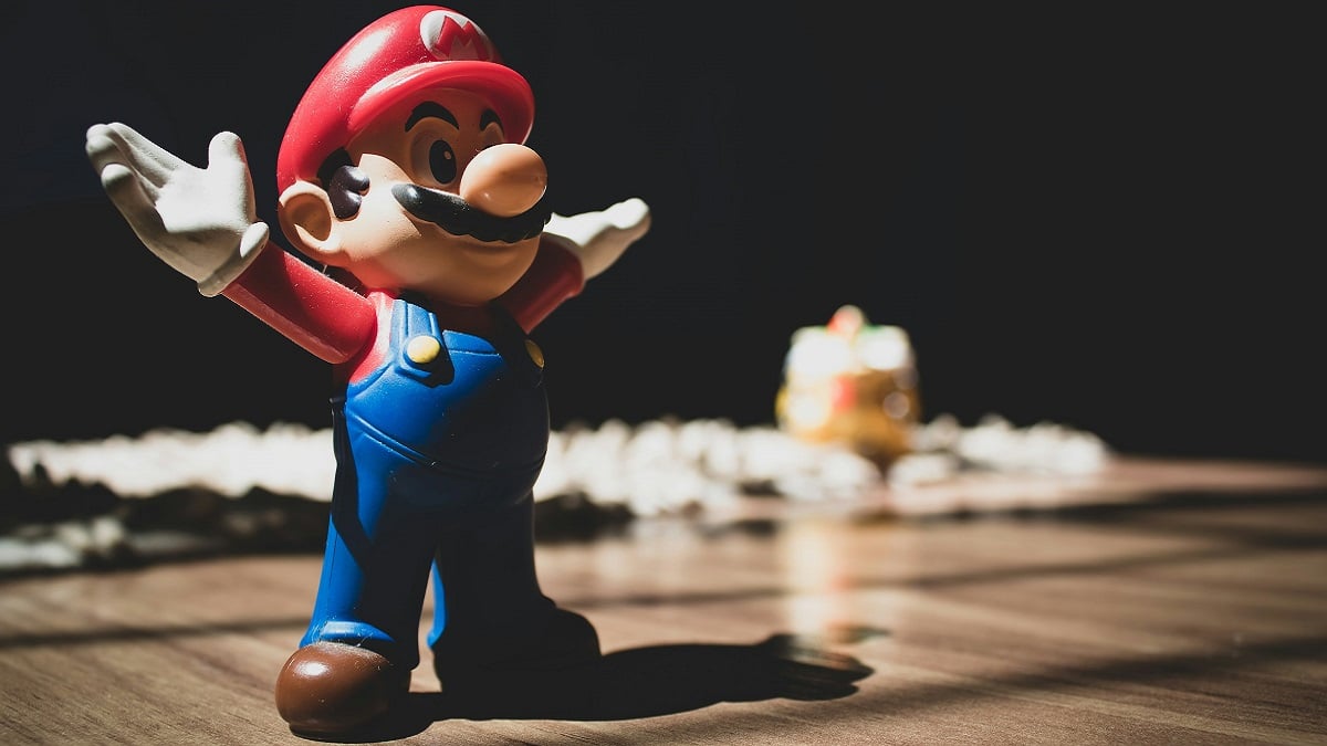 video games industry: a model of Mario stood with his arms wide open.