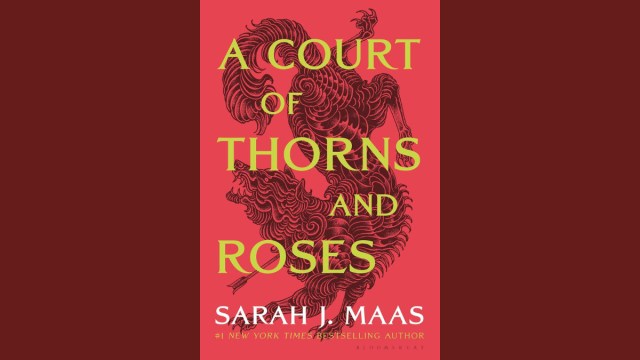 The cover of A Court of Thorns and Roses; depicting a wolf shot with an arrow.