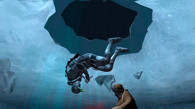 Splinter Cell Double Agent: Sam Fisher hangs upside down under icy water while he holds a knife.