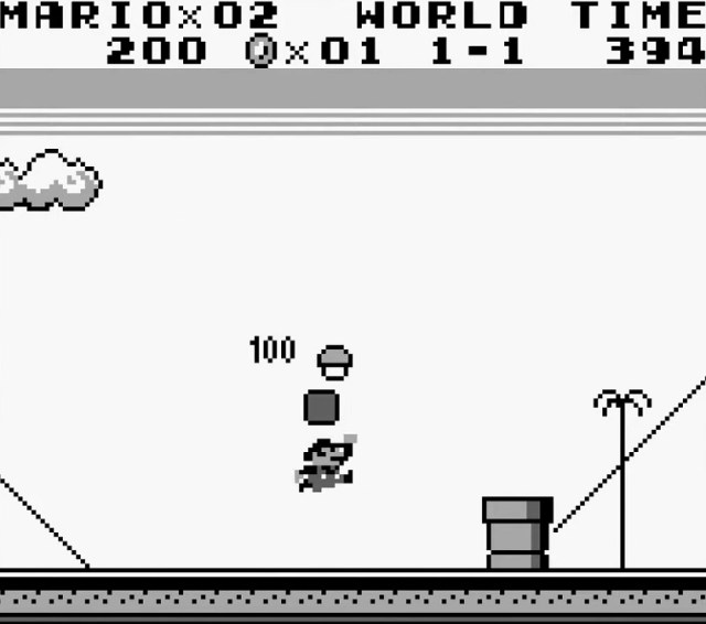 Super Mario Land: a screenshot from the Game Boy game, showing Mario about to jump over a large block.