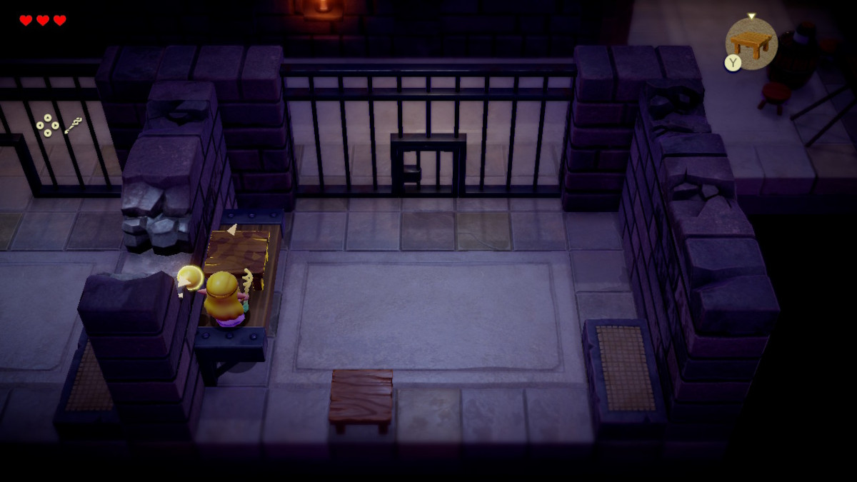 Use a table to get over the crumbling wall of the cell in Zelda: Echoes of Wisdom