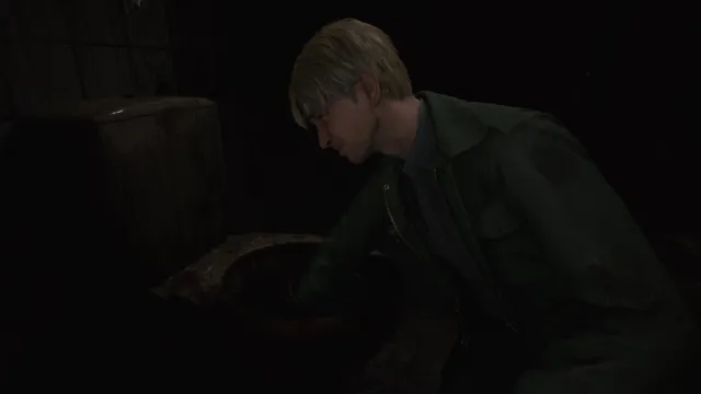 Silent Hill 2 Remake James reaches his hands into a disgusting toilet.