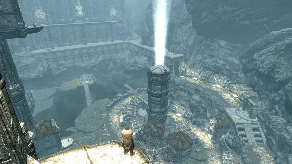 The Forgotten City: A screenshot from a Skyrim mod showing the player looking down on the large ruins of an ancient city.