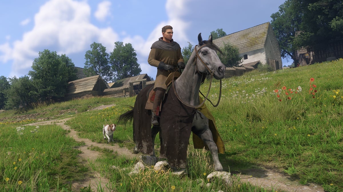 A screenshot of Henry riding on Pebbles in Kingdom Come: Deliverance 2, with Mutt in the background.