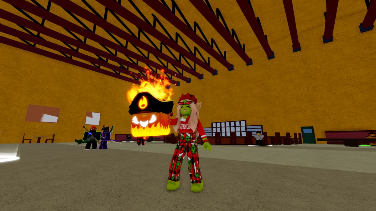 A Blox Fruits character is holding a Flame Fruit