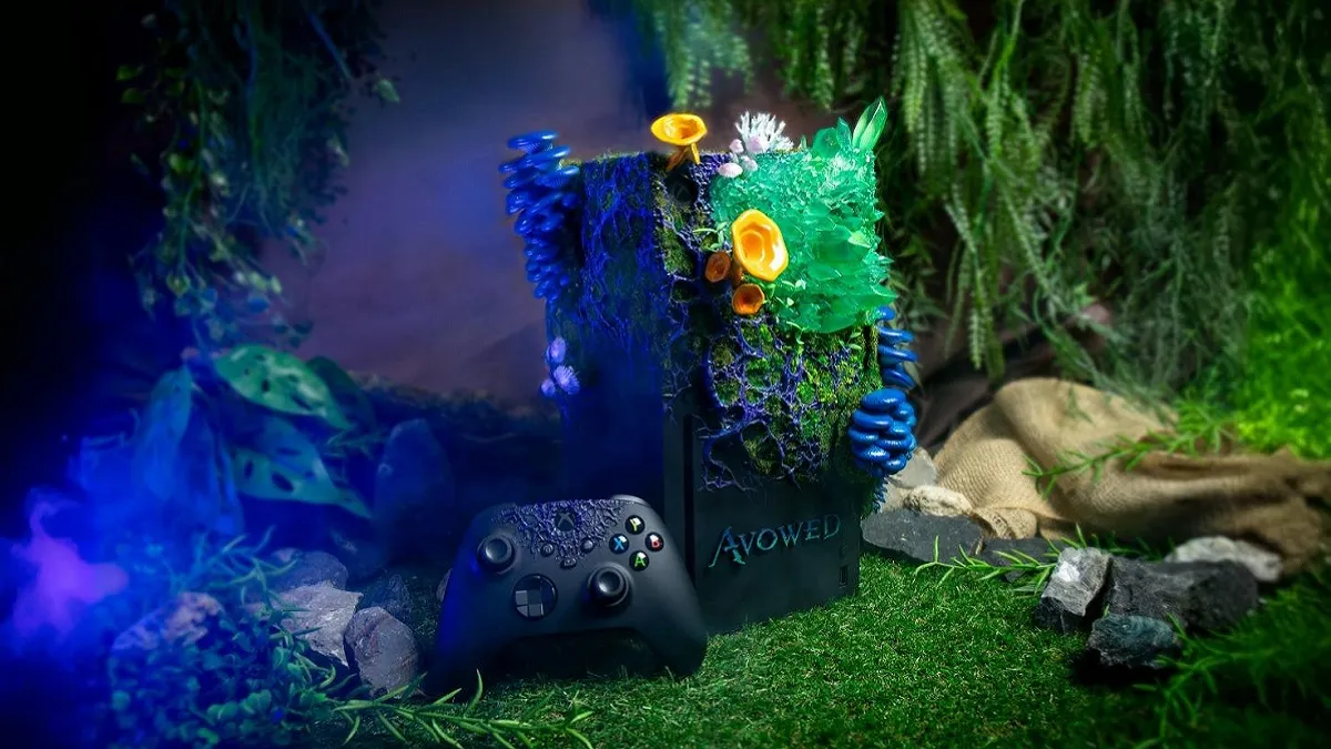 An Avowed-themed Xbox Series X, showing the console covered in vegetation, with greenery behind it.